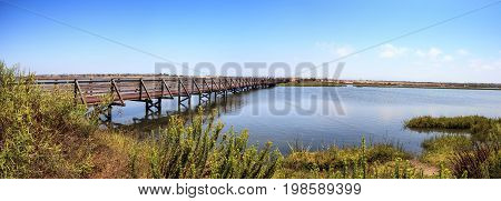 Bridge Along The Peaceful And Tranquil Marsh Of Bolsa Chica Wetlands