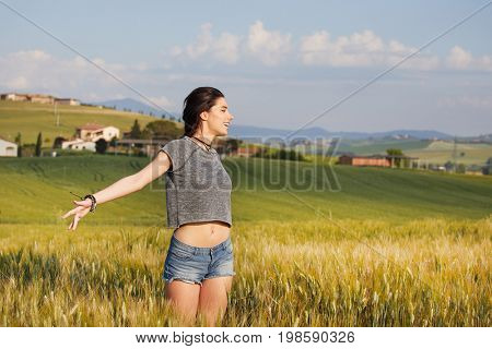 Happy beautiful woman in meadow. Freedom concept background.