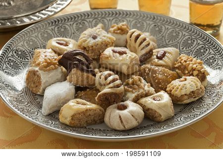 Traditional variety of festive Moroccan cookies and mint tea