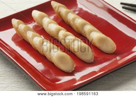 Dish with sliced Japanese pickled burdock roots called gobo