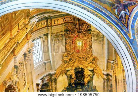 ROME, ITALY - JANUARY 18, 2017 Throne Bernini Holy Spirit Dove From Dome Saint Peter's Basilica Vatican Rome Italy. Bernini created Saint Peter's Throne with Holy Spirti Dove Stained Glass Amber in 1600s