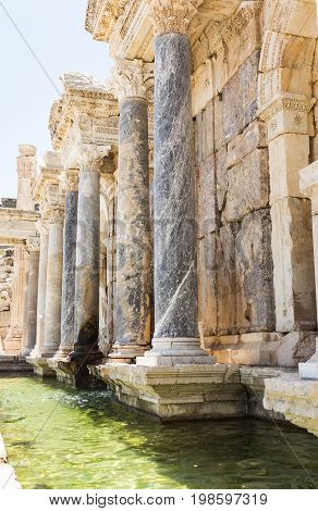 Ancient city Sagalassos ruins columns, sculpture and big stones