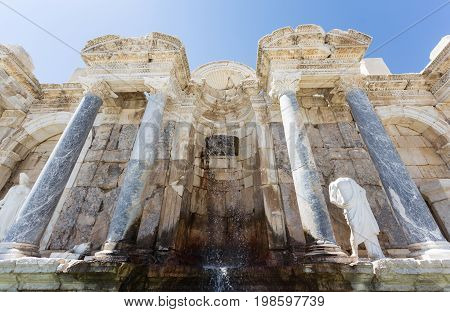 Ancient city Sagalassos ruins columns, sculpture and big stones