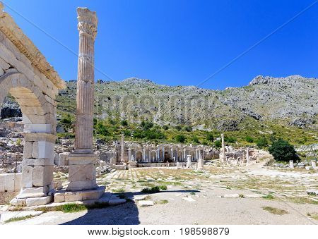 View of agora at ancient city of Sagalassos with column and arch
