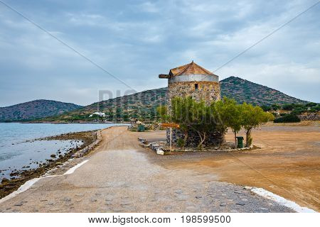Ancient Windmill On Kalydon Peninsula Near Agios Nikolaos, Crete, Greece