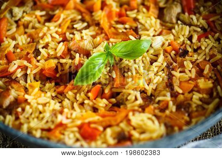 Pilaf with beef, carrots, onions, garlic, pepper and cumin. A traditional dish of Asian cuisine.