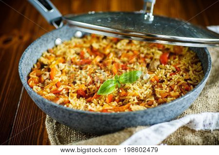 Pilaf with beef, carrots, onions, garlic, pepper and cumin. A traditional dish of Asian cuisine.