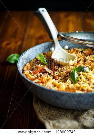 Pilaf with beef, carrots, onions, garlic, pepper and cumin. A traditional dish of Asian cuisine.