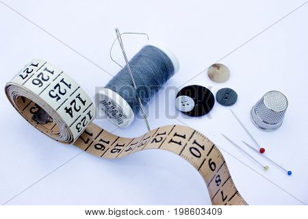 Sewing thread coils needles needle threader scissors push pins thimble tailor's measure