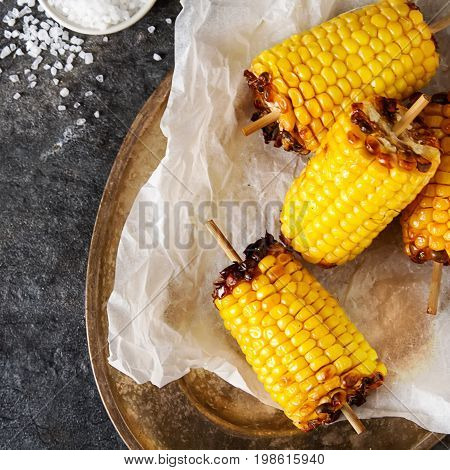Corn Grilled With Salt And Spices. Dark Background. Fast Food In