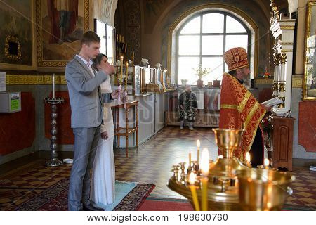 Alchevsk, Ukraine - April 28, 2017: Wedding Ceremony For Newlyweds In The Church