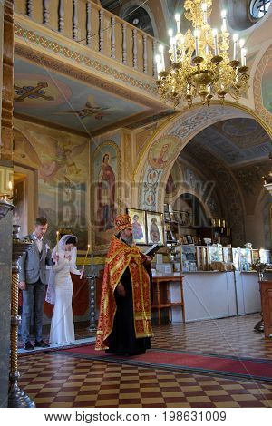 Alchevsk, Ukraine - April 28, 2017: Wedding Ceremony For Newlyweds In The Church