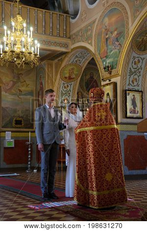 Alchevsk, Ukraine - April 28, 2017: Wedding Ceremony For Newlyweds In The Church
