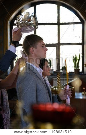 Alchevsk, Ukraine - April 28, 2017: Wedding Ceremony For Newlyweds In The Church