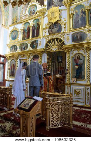 Alchevsk, Ukraine - April 28, 2017: Wedding Ceremony For Newlyweds In The Church
