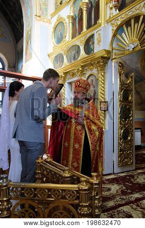 Alchevsk, Ukraine - April 28, 2017: Wedding Ceremony For Newlyweds In The Church