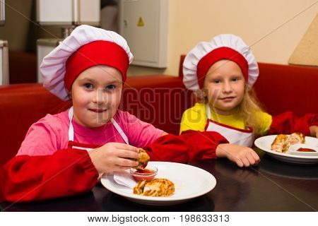 Alchevsk, Ukraine - July 23, 2017: School Cook For Children. Meat Rolls With Cheese Are Prepared.
