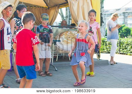 Alchevsk, Ukraine - July 27, 2017: Happy Children Play With Animators In Summer