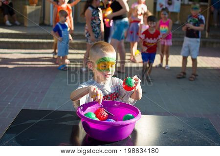 Alchevsk, Ukraine - July 27, 2017: Happy Children Play With Animators In Summer
