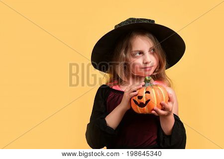 Child In Witch Costume And Jack O Lantern