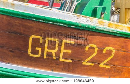 GREETSIEL, GERMANY - JULY 18, 2017: Identification number on an old fishing boat in Greetsiel, Germany