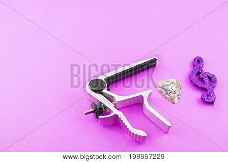 Transportation and pua to play the guitar and key of sun. Pink Background.