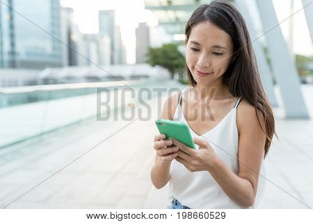 Woman checking on mobile phone