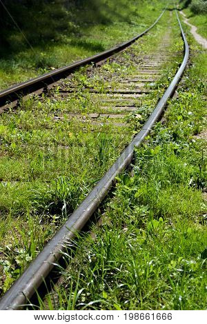 Old abandoned railway overgrown with grass Old abandoned railway