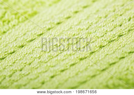 Green cotton fabric texture background. Makro shot.