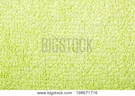 Green cotton fabric texture background. Makro shot.