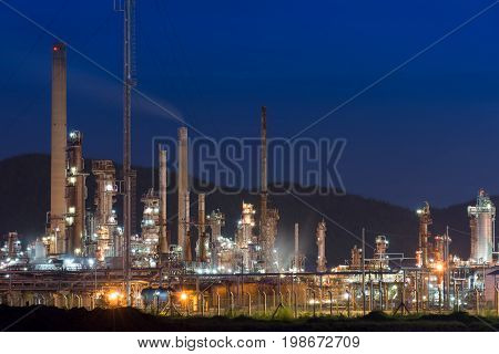 Oil Refinery factory at twilight petrochemical plant Petroleum Chemical Industry