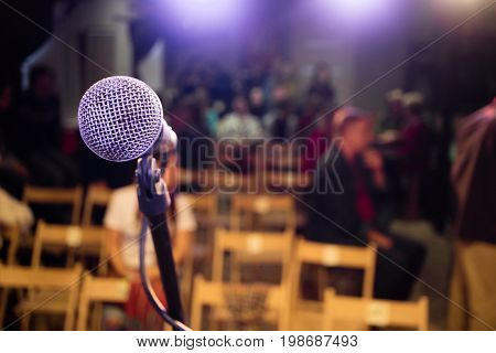 Microphone on stage in the background of the auditorium