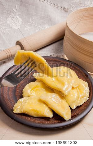 Close Up View Of Boiled Varenyky Or Dumpling With Cottage Cheese Or Curd On Metal Fork. Fresh Boiled