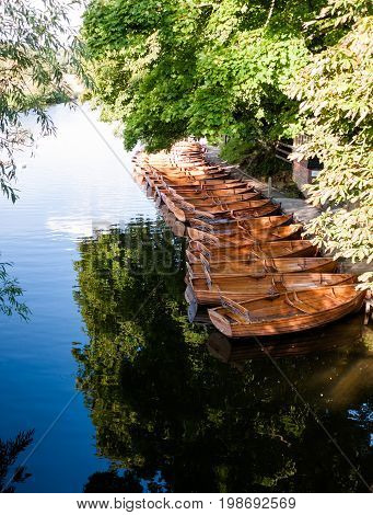A Group Of Parked Wooden Row Boats From Above In Dedham On The River Stour