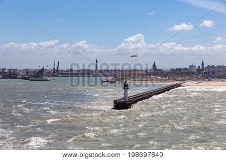 French harbor of Calais with breakwater and heavy storm