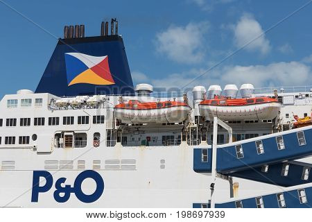 HARBOR CALAIS FRANCE - JUNE 07 2017: Ferry to England moored for embarking or disembarking at harbor gate in Calais France