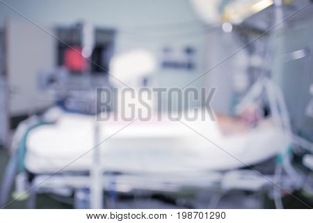 Critical care unit with patient unfocused background.