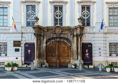 SIBIU ROMANIA - JUNE 19 2017: facade of brukenthal national museum building in baroque style on large square Huet.