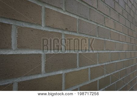 Brick wall angled away from the camera