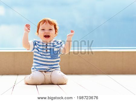 Cute Excited Toddler Baby Having Fun On Decking
