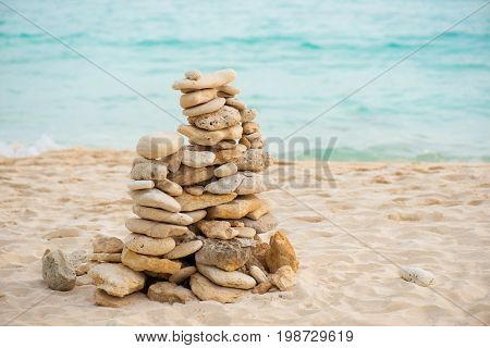 Balance stone on sea coast. Zen rocks on the beach. Feng Shui balance.
