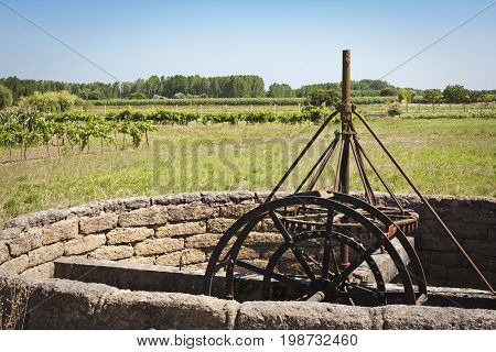 Old Noria in iron on the Green agricultural fields