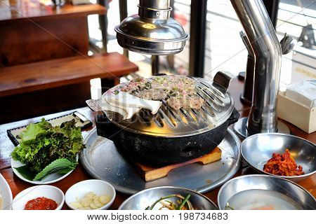 Korean traditional cuisine: meat with vegetables on fire roaster