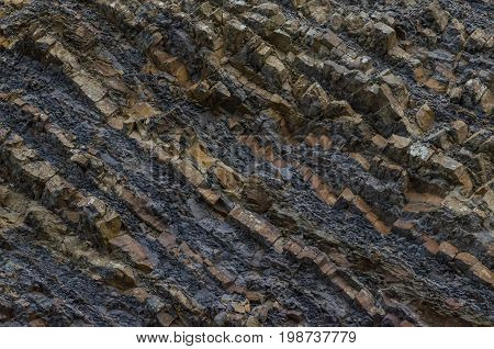 A background made out of a mountain that has had a slide