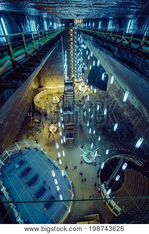 Turda Salt Mine - Romania. As is - a mini football, table tennis, cinema, children's playgrounds. A huge underground space, dominant view.