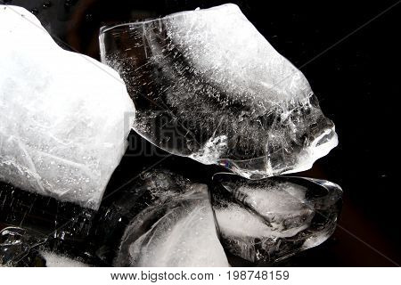 Ice block / An ice cube is a small, roughly cube-shaped piece of ice, conventionally used to cool beverages