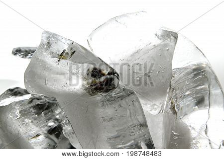 Ice block / An ice cube is a small, roughly cube-shaped piece of ice, conventionally used to cool beverages
