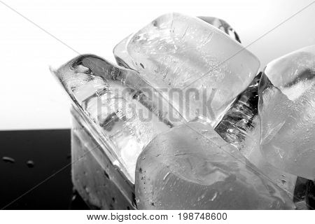 Ice block / An ice cube is a small, roughly cube-shaped piece of ice, conventionally used to cool beverages