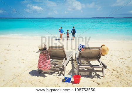 family beach vacation- family with kids on beach holiday