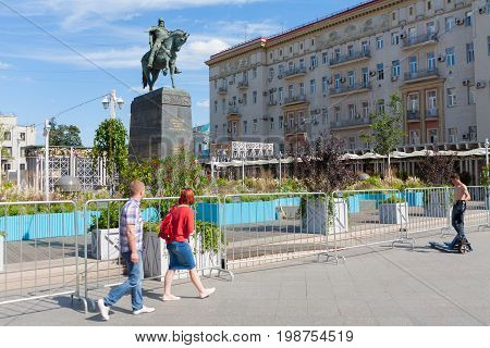 MOSCOW - AUGUST 7: People Yuri Dolgoruky monument and flower beds in Tverskaya Square on August 7 2017 in Moscow. Flower beds were installed during 
